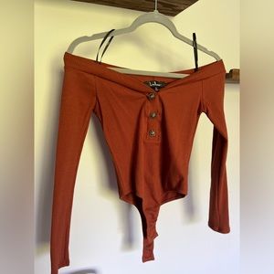 The Lulus Lilyth Rust Brown Ribbed Long Sleeve Off-the-Shoulder Bodysuit